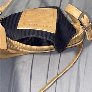 Light brown leather coach crossbody purse